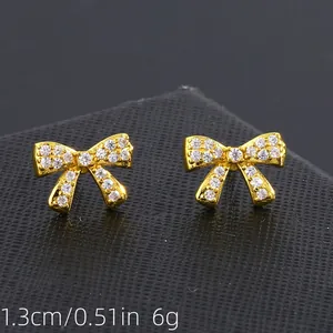 Copper bow stud earrings with micro-inlaid zircons and detailed dimensions of 1.3cm