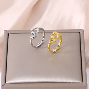 Close-up of interlocking double heart rings with micro-pave cubic zirconia accents
