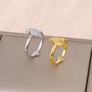 Elegant gold and silver crossover rings with leaf-shaped pavé cubic zirconia accents