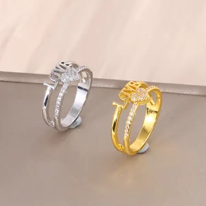 Elegant gold and silver LOVE heart rings featuring micro-set cubic zirconia accents