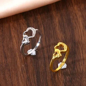 Double heart zircon ring set in gold and silver finish with elegant polished metal luster