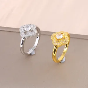 Luxurious four-leaf clover moissanite rings in silver and gold with sparkling zircons