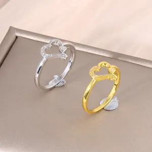 Anello a doppio cuore in oro e argento con zircone rosa e cristalli micro-pave