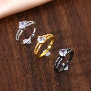 Macro detail of double-layer bifurcated rings with micro-pave zircons in gold, silver, and black