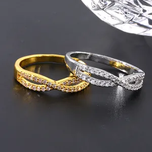 Infinity crossover rings in gold and silver finish with micro-pave cubic zirconia settings