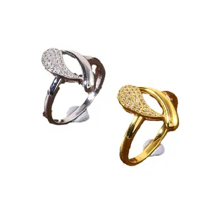 Elegance copper infinity teardrop rings with cubic zirconia pavé in gold and silver