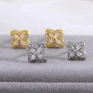 Élégantes boucles d'oreilles fleur à quatre feuilles dorées et argentées en zircons