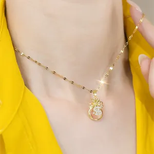 Gold dollar sign money bag pendant necklace with pink gem and sparkling zircon accents