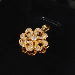 Rotating heart clover pendant with cubic zirconia micro-inlay in 14K gold plating