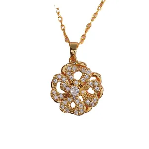 Gold rotating heart clover necklace with micro-paved cubic zirconia on white background