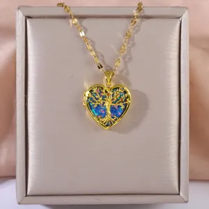 Collana con ciondolo a cuore dorato con albero della vita e intarsio in opale blu