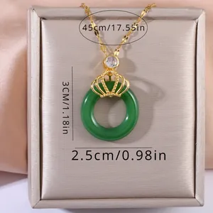 Macro detail of crown jade pendant necklace with dimensions 45cm chain and 3cm pendant