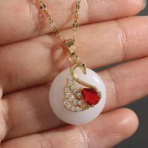 Micro-inlaid zircon swan pendant necklace in gold finish with white jade and red stones