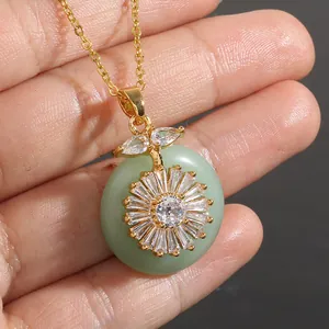 Gold sunflower necklace with light green round stone and micro-paved cubic zirconia