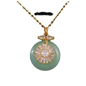 Gold sunflower necklace with green gemstone disc and sparkling zircon accents for women