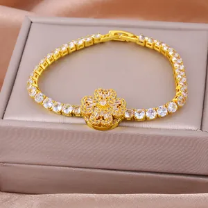 Gold rotating flower bracelet with micro-paved zircons on elegant silk display