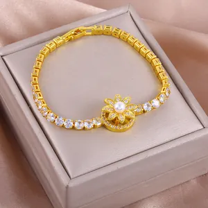 Bracelet tournesol rotatif avec perle et zircons sertis au fini doré luxueux