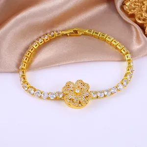 Elegant gold flower bracelet with micro-paved zircons and a spinning four-leaf clover design