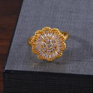 Elegant rotating double-layer sunflower ring with copper micro-set zircons on a gray box