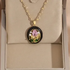 Detail of rose coin pendant with pink pear-cut stone and micro-pave crystals