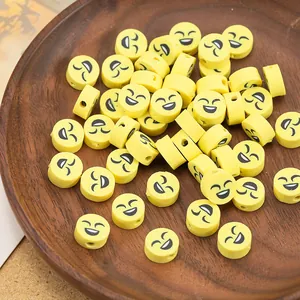 Κίτρινες χάντρες smiley 10mm από πηλό για κατασκευή κοσμημάτων DIY σε δίσκο
