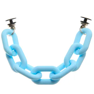 Close-up of light blue acrylic chain shoe charms with matte finish for clog sandals