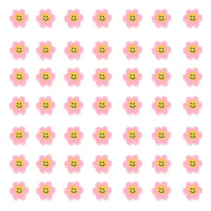 Vue macro de perles fleurs roses à visage souriant pour création de bijoux DIY