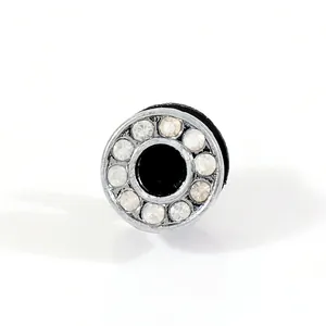 Macro view of black round stud earrings with sparkling rhinestones and silver metal finish