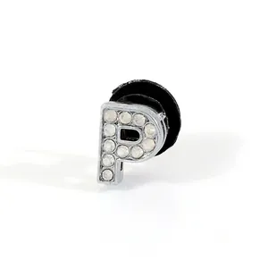 Close-up of letter P rhinestone charm for garden clogs with silver crystal finish