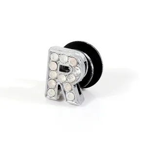 Detail of silver letter R shoe charm with sparkling white rhinestones for clogs