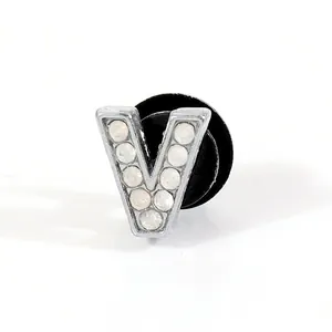 Silver V-shaped shoe charm with sparkling rhinestones and a black round secure back buckle