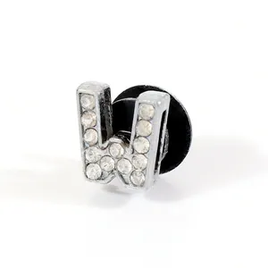 Detailed close-up of a silver letter W shoe charm with sparkling rhinestones for clogs