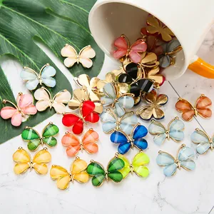 Colorful acrylic butterfly shoe charms accessories pouring from a white porcelain cup