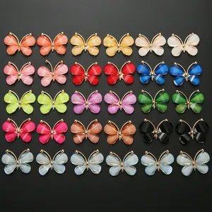 Detailed grid view of 30 colorful DIY butterfly charms with elegant gold metal frames
