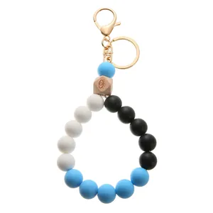 Silicone beaded bracelet keychain with evil eye wood bead and gold metal clasp