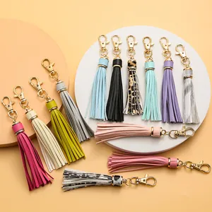 Colorful PU leather tassel keychain collection with gold clips in thirteen vibrant colors
