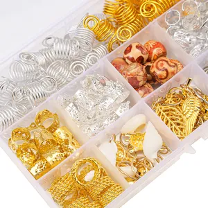 Detail view of gold and silver dreadlock beads with shells and metal rings in a clear box