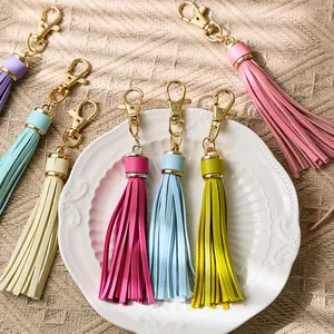 Pastel PU leather tassel keychains with gold lobster clasps in various macaron colors
