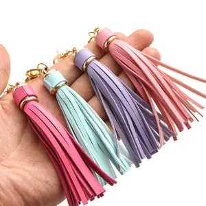 Detail of colorful PU leather tassels with golden lobster clasps for DIY keychains