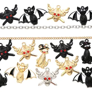 Detailed view of Halloween bat, skull and cat charms with enamel and rhinestones