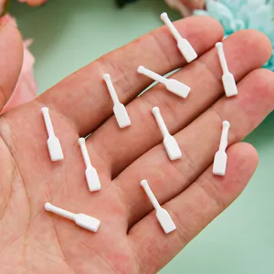 Set van 10 witte mini-peddels van hars voor creatieve DIY-sieraden en handwerkprojecten