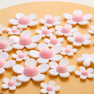 DIY resin flower charms in white and pink matte finish for phone cases and hair accessories
