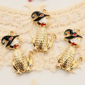 Close-up of enamel cat pendants with wizard hats for Halloween DIY jewelry making