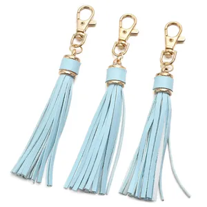 Detailed view of light blue PU leather tassels with premium golden lobster clasps