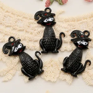 Detailed view of three black cat charms with witch hats for Halloween jewelry DIY