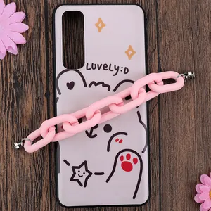 Pink cartoon bear phone case with chunky acrylic chain on dark wooden background