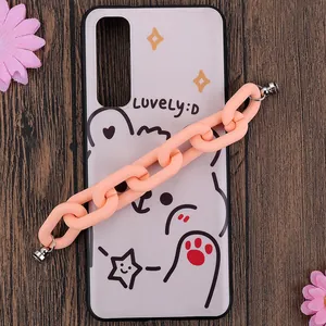 Cute cartoon bear phone case with chunky pink resin chain on dark wood background