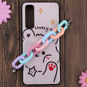 Close-up of lavender phone case with cartoon bear design and colorful macaron chain