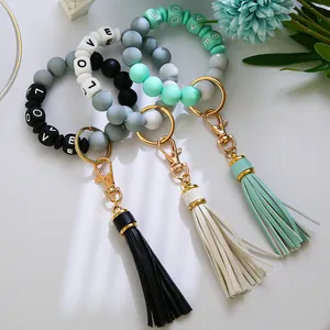 Details von Silikon-Perlenarmbändern mit Lederquasten und LOVE-Buchstabenperlen-Anhänger