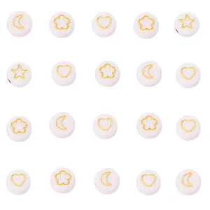 Macro detail of white acrylic beads with gold moon heart and star patterns for DIY jewelry